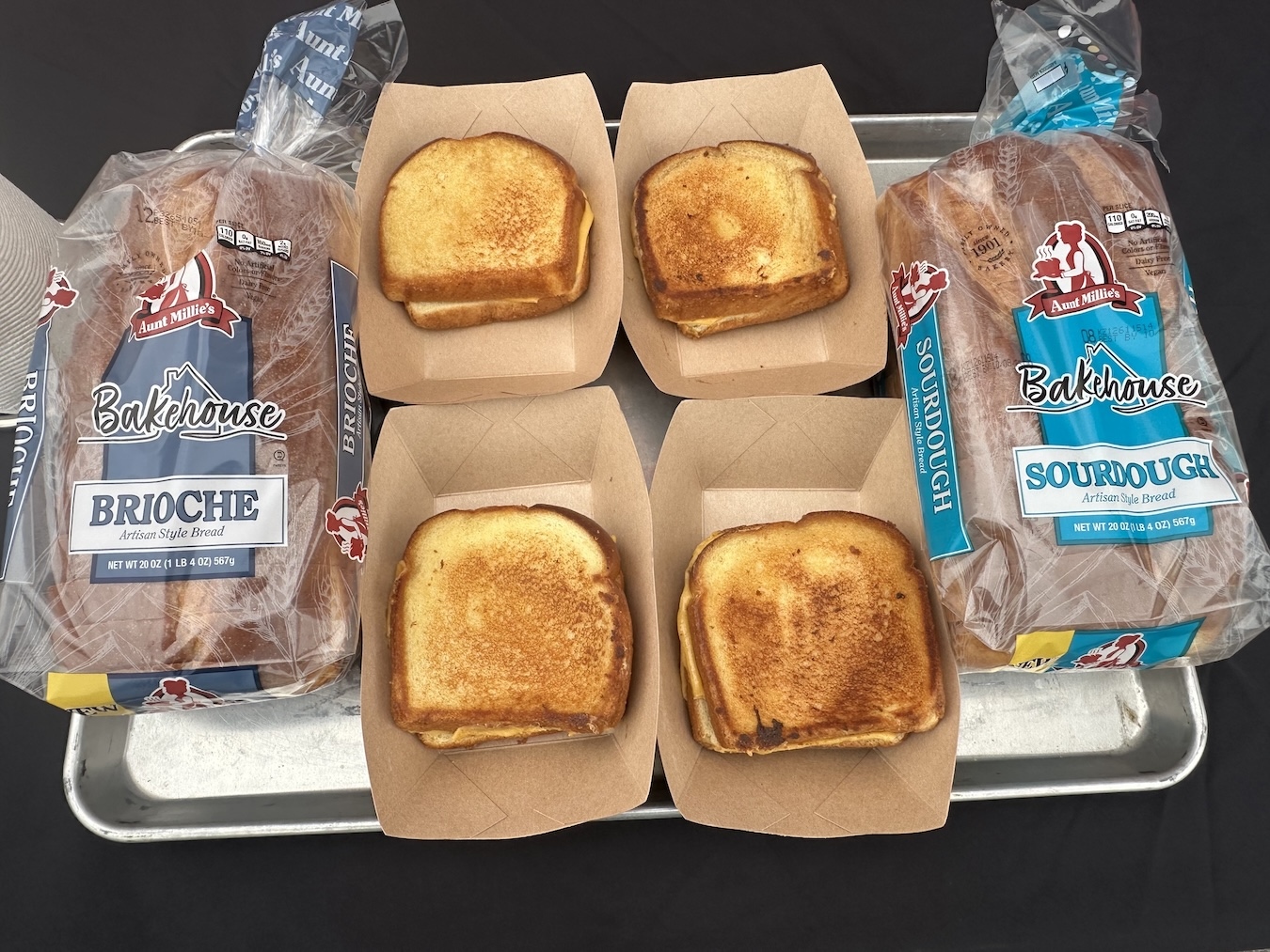 Aunt Millie's Bakehouse Brioche and Sourdough bread loaves with grilled cheese sandwiches