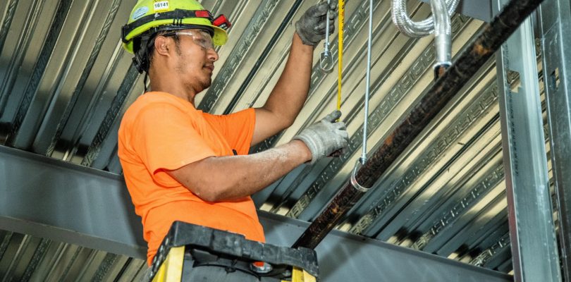 DSC 6143 1 1 Guy working on hangers updated