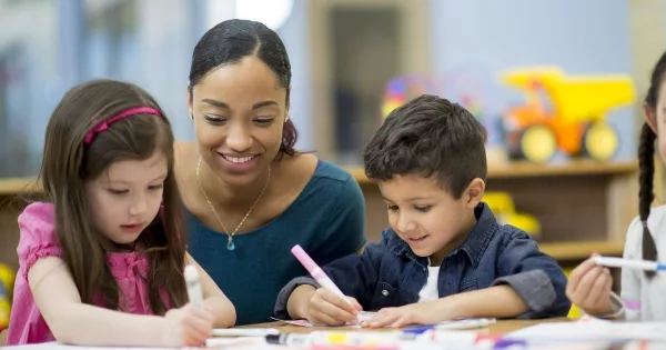 Teacher with young students 0