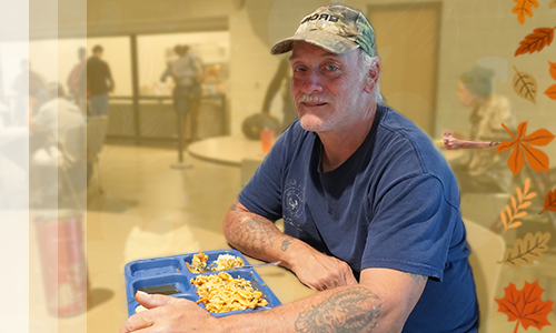 Man with a meal at The Mission.