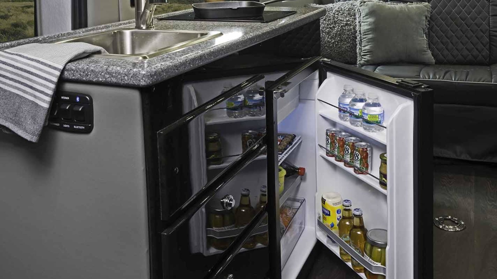 Residential living with refrigerator and cooktop.